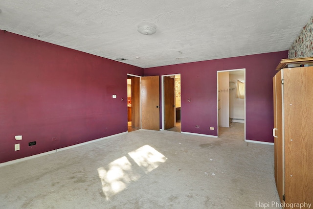 74 Dundee Ln, Barrington Hills, IL 60010 - unfurnished bedroom featuring a baseboard radiator, carpet floors, and a textured ceiling