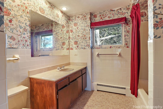74 Dundee Ln, Barrington Hills, IL 60010 - bathroom with baseboard heating, wallpapered walls, tile walls, vanity, and a wainscoted wall