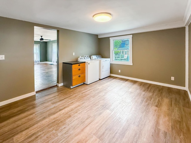 821 W Douglas St, Freeport, IL 61032 - laundry area featuring washer and clothes dryer, light wood-style flooring, and ceiling fan