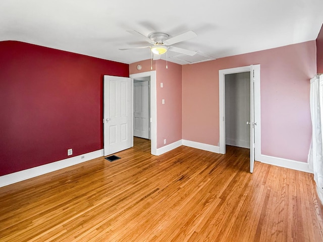 821 W Douglas St, Freeport, IL 61032 - unfurnished bedroom with light wood-style floors and a ceiling fan
