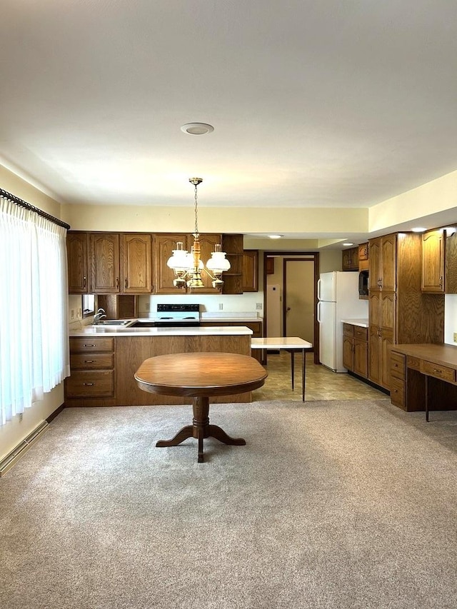 70 N Main St, Lamoille, IL 61330 - kitchen featuring a peninsula, a chandelier, hanging light fixtures, electric range oven, and freestanding refrigerator
