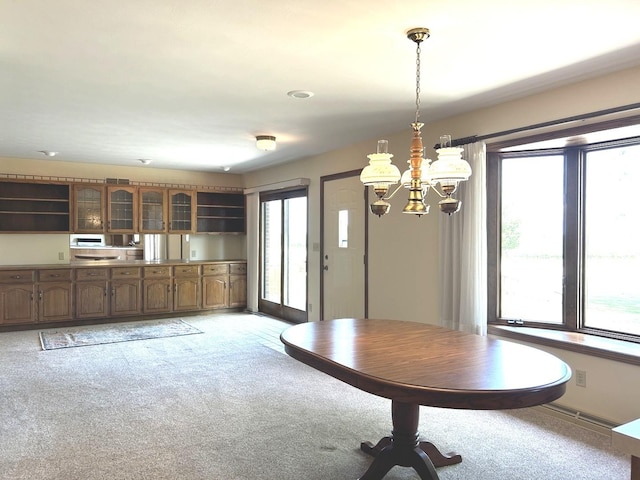 70 N Main St, Lamoille, IL 61330 - dining space with a chandelier and light carpet