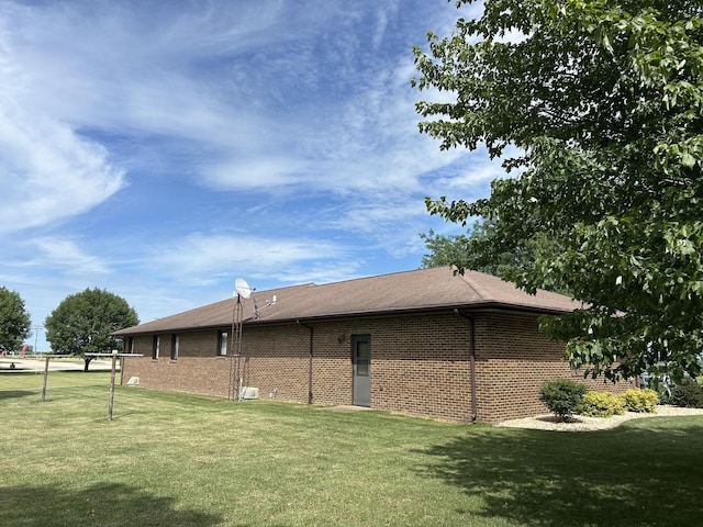 70 N Main St, Lamoille, IL 61330 - rear view of house with a yard and brick siding