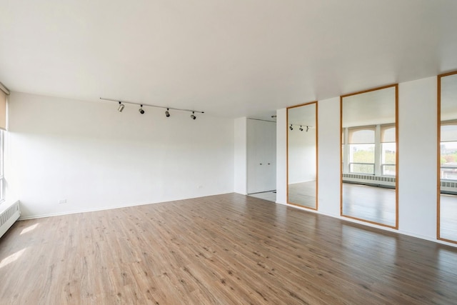 1450 E 55th Pl Unit 630S, Chicago, IL 60637 - unfurnished room with track lighting and wood finished floors