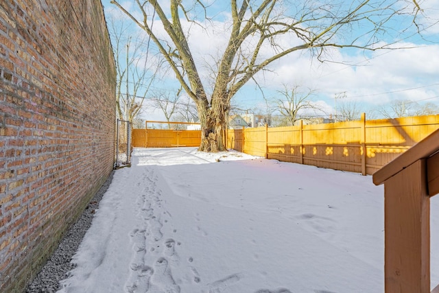 6944 S Racine Ave, Chicago, IL 60636 - yard layered in snow with a fenced backyard
