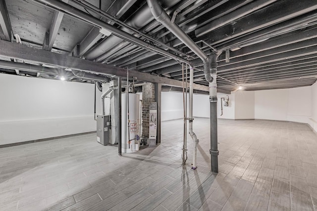 6944 S Racine Ave, Chicago, IL 60636 - below grade area with gas water heater and wood finished floors