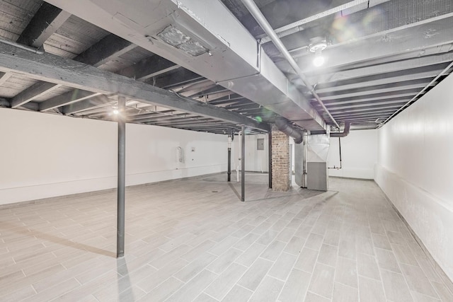 6944 S Racine Ave, Chicago, IL 60636 - basement with heating unit and wood finished floors