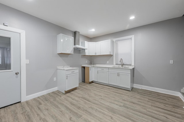 6944 S Racine Ave, Chicago, IL 60636 - kitchen with wall chimney range hood, light wood-type flooring, white cabinetry, light countertops, and recessed lighting