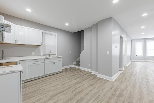 6944 S Racine Ave, Chicago, IL 60636 - kitchen with light countertops, light wood-type flooring, white cabinetry, and recessed lighting