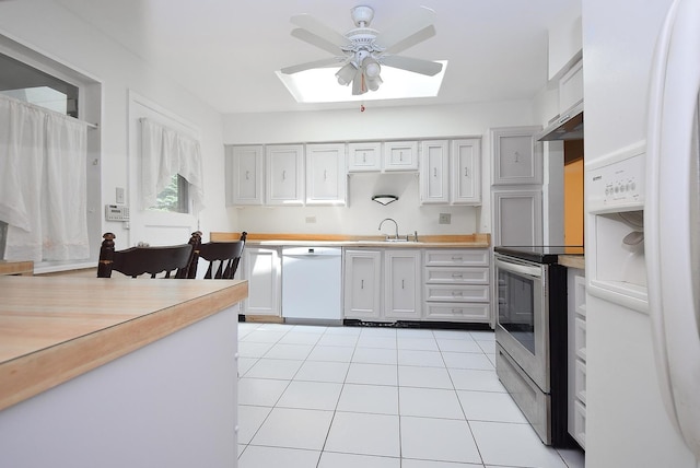 50 Ridgewood Rd, Elk Grove Village, IL 60007 - kitchen featuring white appliances, a skylight, ceiling fan, and light countertops