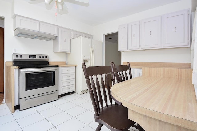 50 Ridgewood Rd, Elk Grove Village, IL 60007 - kitchen with stainless steel range with electric stovetop, white fridge with ice dispenser, under cabinet range hood, a ceiling fan, and light tile patterned flooring