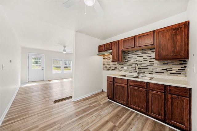 2133 Luther Ave, Lockport, IL 60441 - kitchen with a ceiling fan, light wood finished floors, and tasteful backsplash