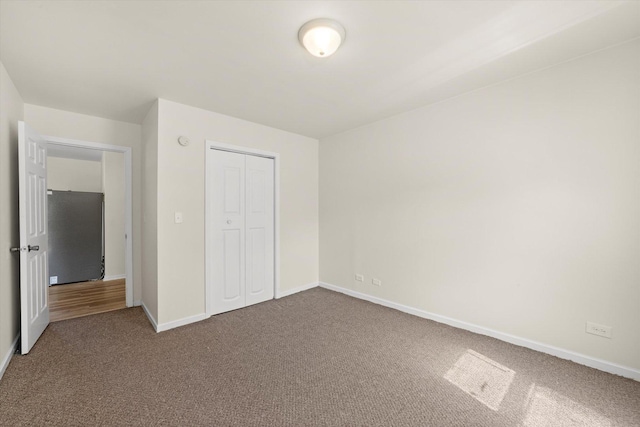 2133 Luther Ave, Lockport, IL 60441 - unfurnished bedroom with dark colored carpet and a closet