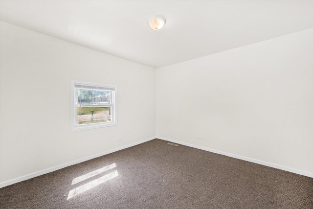 2133 Luther Ave, Lockport, IL 60441 - empty room featuring dark carpet and baseboards