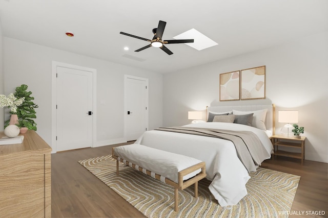 8114 S Paxton Ave, Chicago, IL 60617 - bedroom with a skylight, wood finished floors, ceiling fan, and recessed lighting