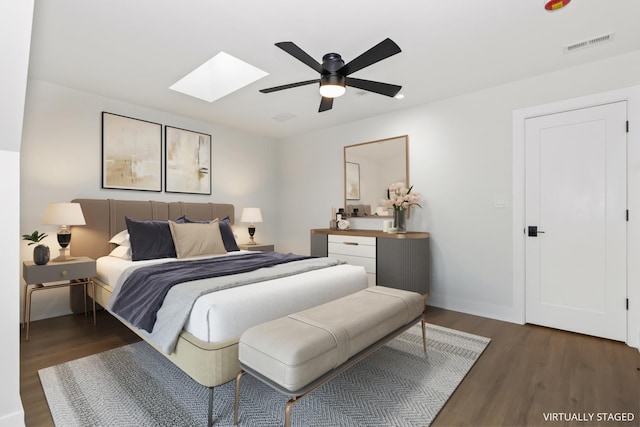 8114 S Paxton Ave, Chicago, IL 60617 - bedroom with a skylight, wood finished floors, and a ceiling fan