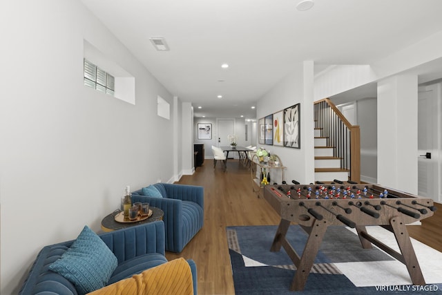 8114 S Paxton Ave, Chicago, IL 60617 - recreation room featuring wood finished floors and recessed lighting