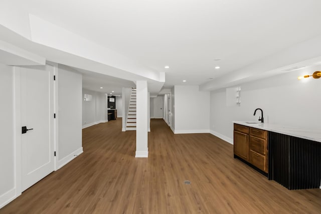 8114 S Paxton Ave, Chicago, IL 60617 - indoor wet bar featuring light wood-style flooring, stairs, and recessed lighting