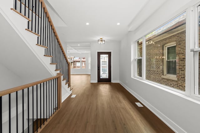 8114 S Paxton Ave, Chicago, IL 60617 - entrance foyer featuring wood finished floors, recessed lighting, stairs, and a chandelier