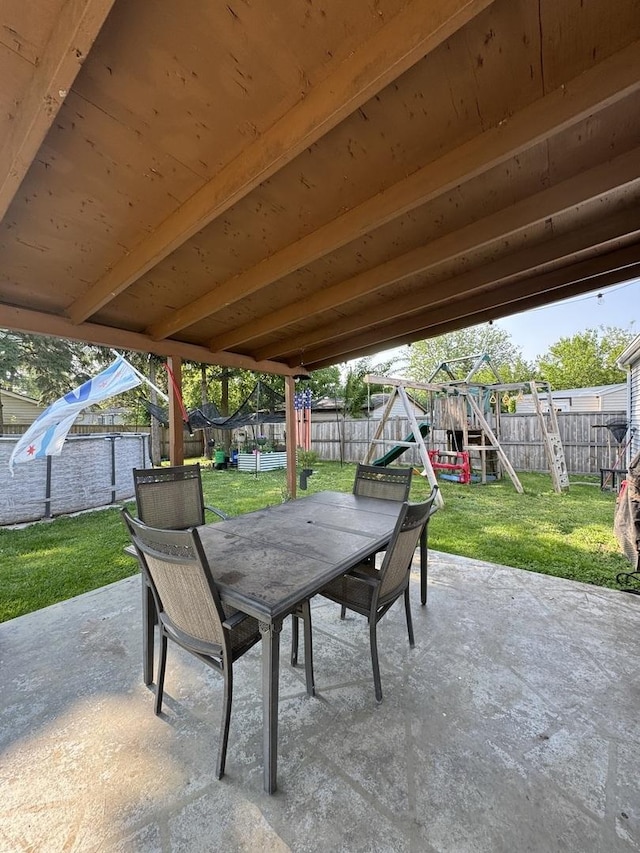 311 Edinburgh Dr, Lockport, IL 60441 - fenced backyard with outdoor dining area, a playground, and a patio area