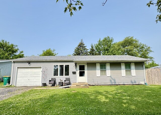 311 Edinburgh Dr, Lockport, IL 60441 - ranch-style house with an attached garage and gravel driveway