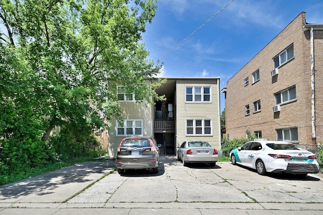view of property with uncovered parking