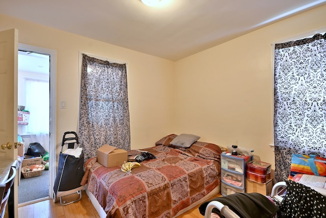 bedroom featuring wood finished floors