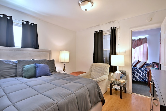 bedroom featuring light wood-style flooring