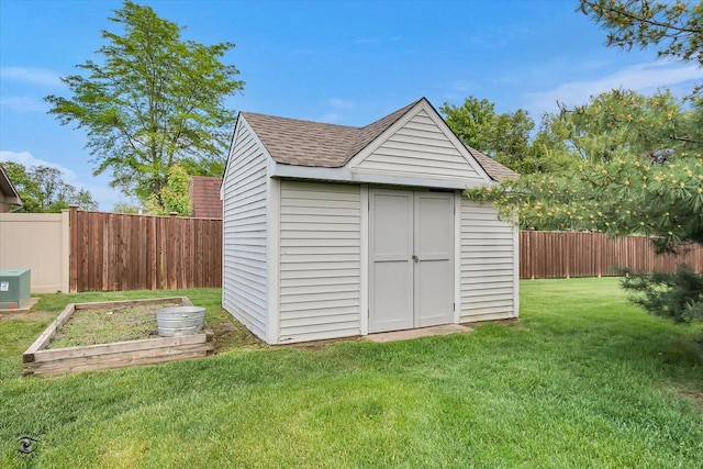 18905 Meadowview Dr, Mokena, IL 60448 - view of shed with a fenced backyard and a vegetable garden