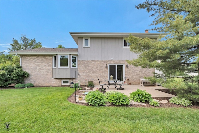 18905 Meadowview Dr, Mokena, IL 60448 - back of property featuring brick siding, a patio, and a yard