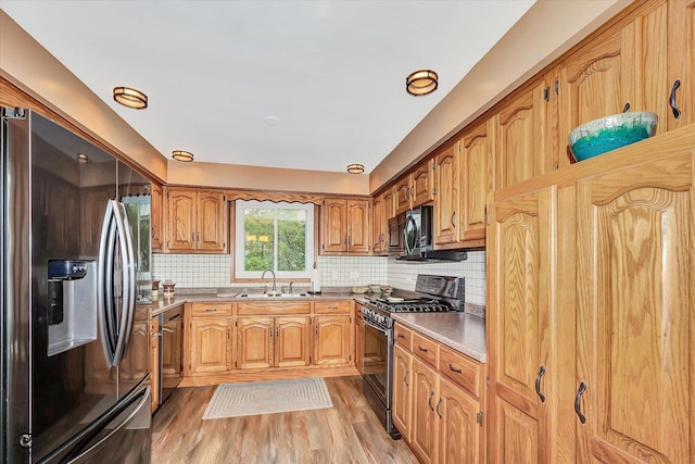 18905 Meadowview Dr, Mokena, IL 60448 - kitchen with stainless steel appliances, light wood-type flooring, tasteful backsplash, light countertops, and brown cabinets