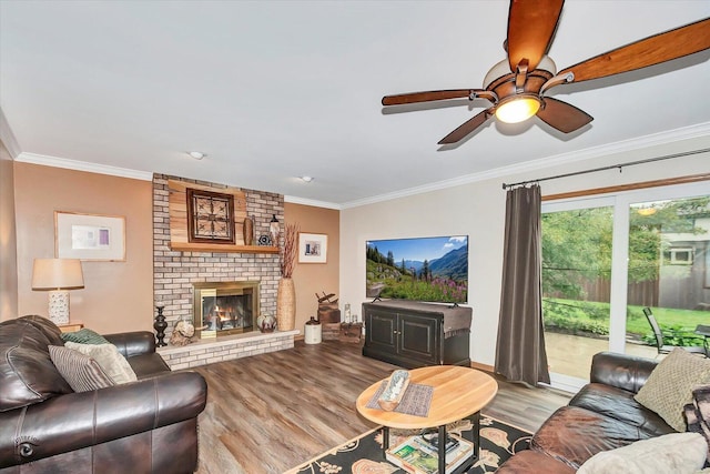 18905 Meadowview Dr, Mokena, IL 60448 - living room featuring ornamental molding, wood finished floors, ceiling fan, and a brick fireplace