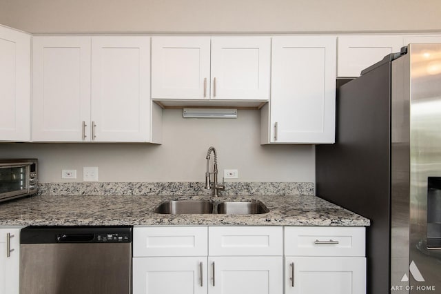257 Coventry Cir Unit 136, Vernon Hills, IL 60061 - kitchen with appliances with stainless steel finishes, white cabinetry, and light stone counters