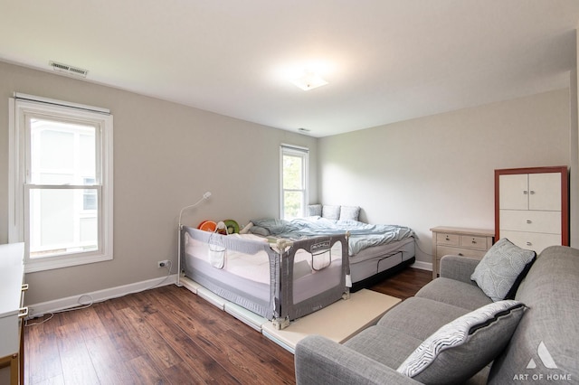 257 Coventry Cir Unit 136, Vernon Hills, IL 60061 - bedroom featuring dark wood finished floors and baseboards