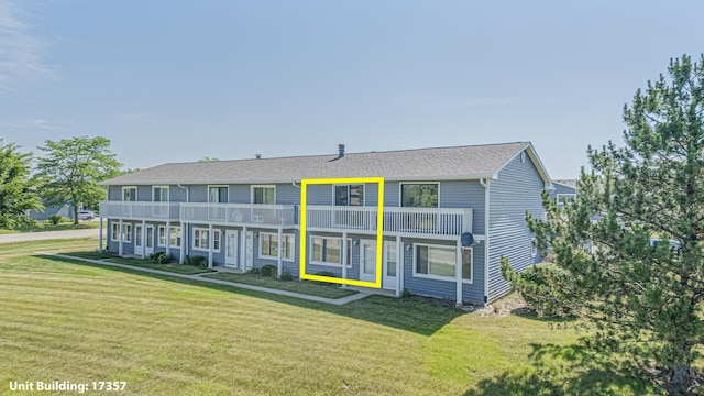 17357 W Maple Ln, Gurnee, IL 60031 - view of front of house featuring a balcony and a front lawn