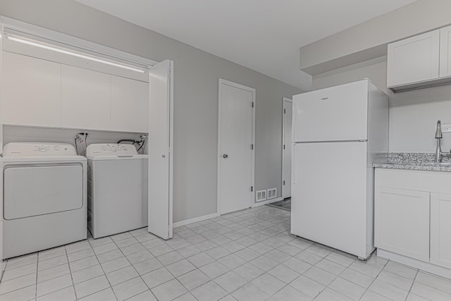 17357 W Maple Ln, Gurnee, IL 60031 - washroom with washing machine and clothes dryer and light tile patterned floors