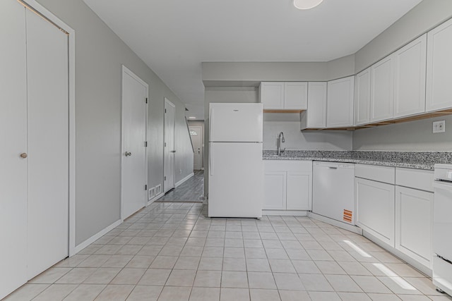 17357 W Maple Ln, Gurnee, IL 60031 - kitchen featuring white appliances, white cabinetry, light tile patterned flooring, and light stone countertops
