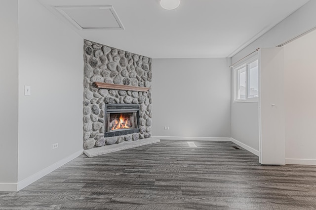 17357 W Maple Ln, Gurnee, IL 60031 - unfurnished living room featuring a fireplace, wood finished floors, and attic access