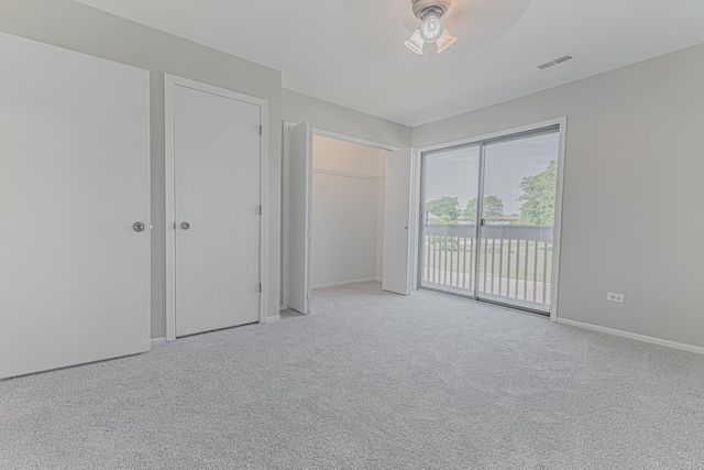 17357 W Maple Ln, Gurnee, IL 60031 - unfurnished bedroom featuring access to exterior, carpet flooring, and a ceiling fan