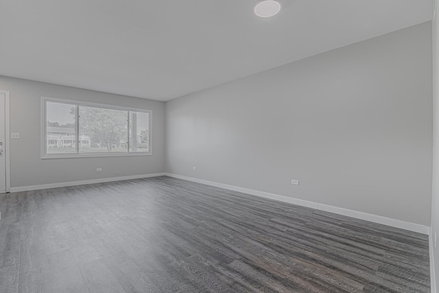 17357 W Maple Ln, Gurnee, IL 60031 - unfurnished room featuring dark wood-type flooring and baseboards