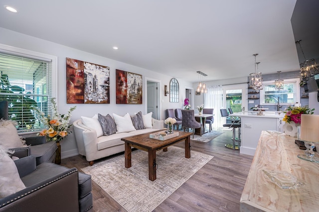 1815 Evergreen Ave, Hanover Park, IL 60133 - living area with a chandelier, dark wood-style flooring, and recessed lighting
