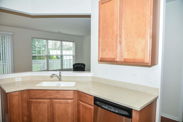 13445 Meadowlark Ln, Huntley, IL 60142 - kitchen with dishwasher, light countertops, a peninsula, and brown cabinetry