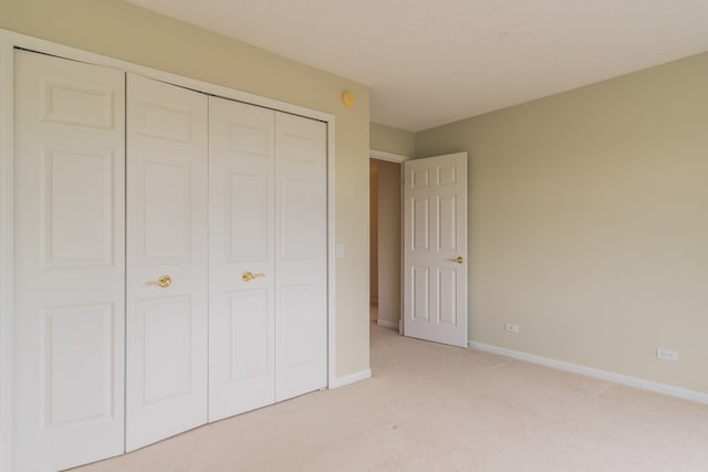 470 Fawell Blvd Unit 411, Glen Ellyn, IL 60137 - unfurnished bedroom with light colored carpet and a closet