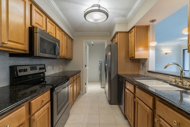 470 Fawell Blvd Unit 411, Glen Ellyn, IL 60137 - kitchen featuring stainless steel appliances, brown cabinetry, a textured ceiling, dark stone counters, and decorative backsplash