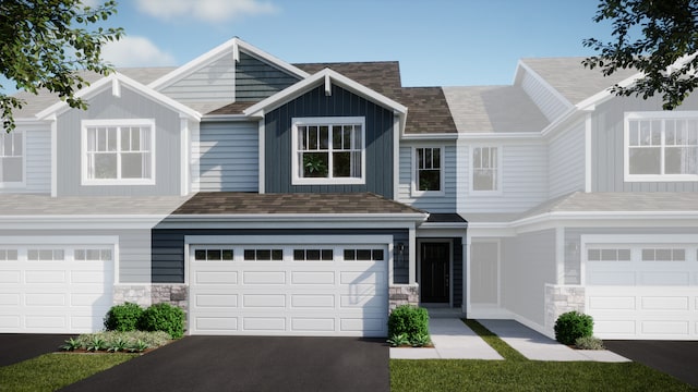 12003 Jordi Rd, Huntley, IL 60142 - multi unit property featuring a garage, stone siding, driveway, and a shingled roof