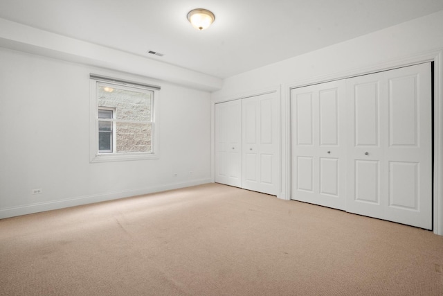 1225 N Paulina St Unit 3S, Chicago, IL 60622 - unfurnished bedroom with multiple closets and light colored carpet