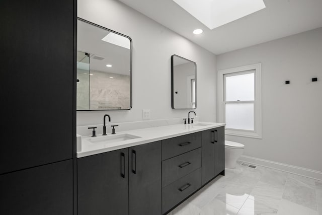 1225 N Paulina St Unit 3S, Chicago, IL 60622 - bathroom with double vanity, a shower, a skylight, marble look tile flooring, and recessed lighting