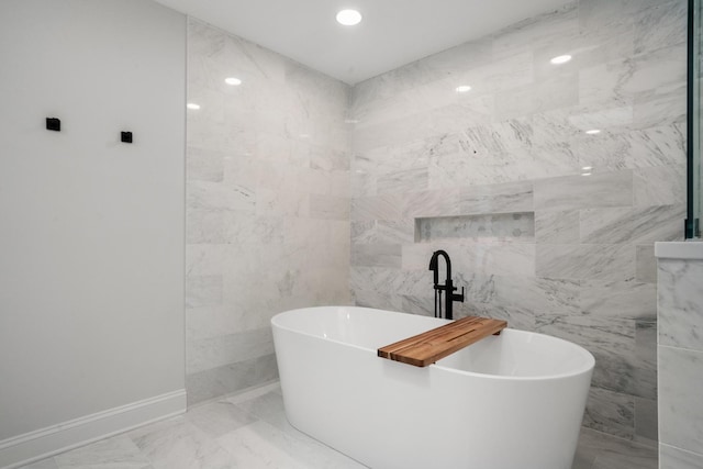 1225 N Paulina St Unit 3S, Chicago, IL 60622 - full bath with tile walls, a soaking tub, marble finish floors, and recessed lighting