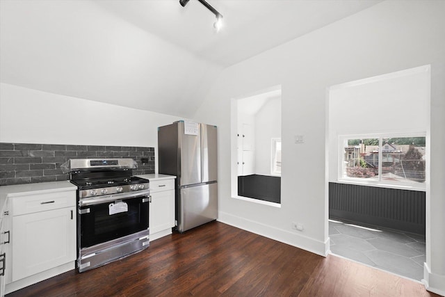 1629 W Foster Ave, Chicago, IL 60640 - kitchen with stainless steel appliances, light countertops, lofted ceiling, dark wood-type flooring, and white cabinets