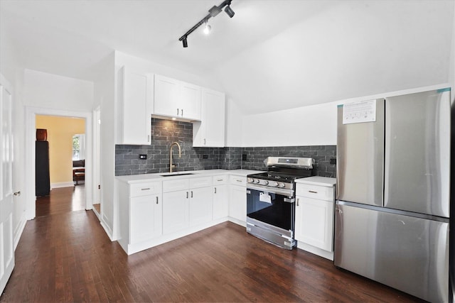 1629 W Foster Ave, Chicago, IL 60640 - kitchen with appliances with stainless steel finishes, light countertops, tasteful backsplash, white cabinetry, and dark wood-type flooring
